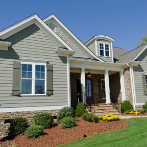 light green home with shutters dracut ma